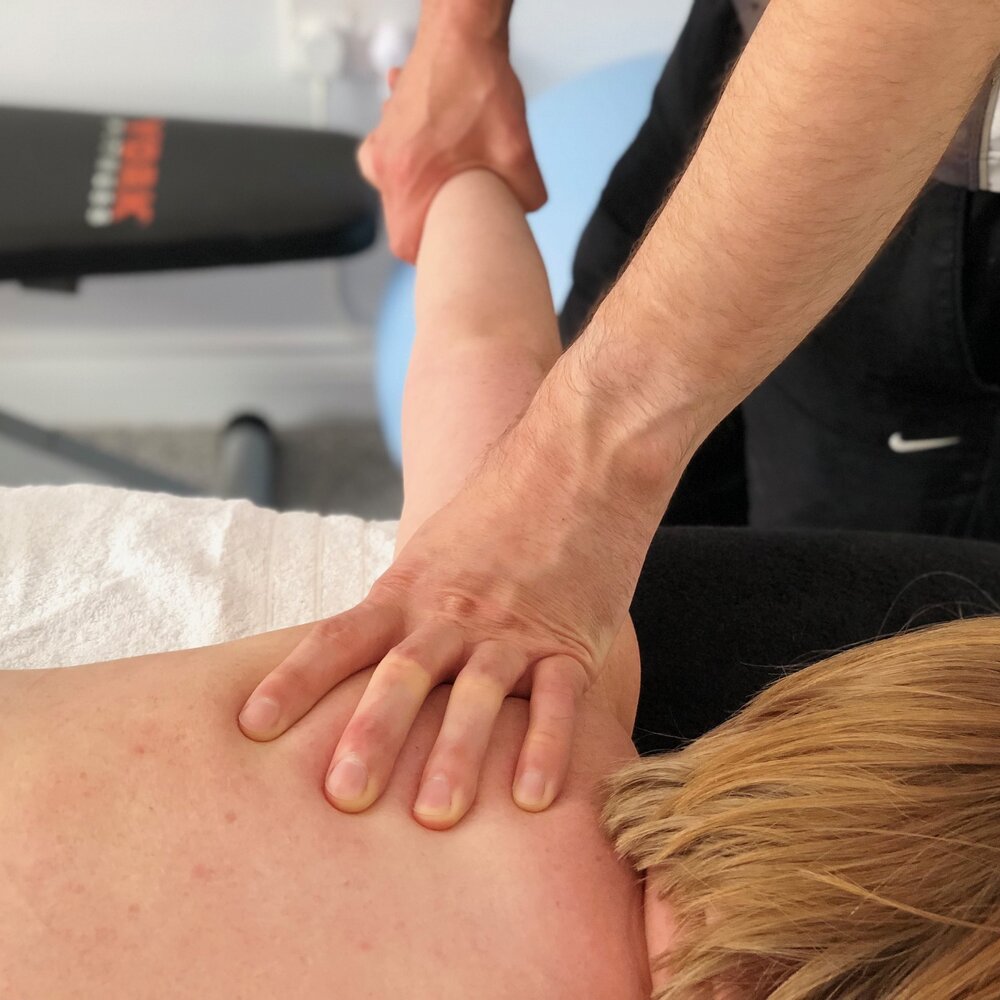 Drew McMullan giving a sports massage treatment