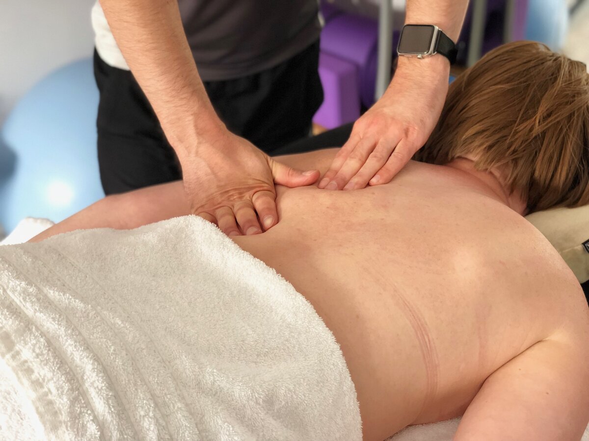 Hands-on soft tissue treatment in progress